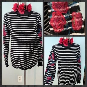 Women’s black & white sweater with roses embroidered on the sleeves; size Large